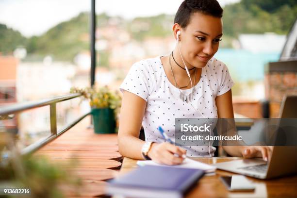 Studying At Rooftop Cafe Stock Photo - Download Image Now - Learning, Studying, Laptop