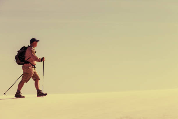 istock Journey through the desert with a backpack and tent. The tent is on a sandy crest. 913686172