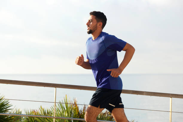 istock healthy young male running outside 913688700
