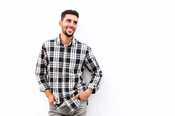 istock cool young arabic man smiling against white background 913688916
