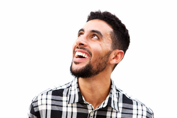 istock Close up young arabic man laughing against white background 913688920