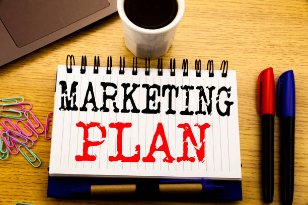 istock Hand writing text caption showing Marketing Plan. Business concept for Planning Successful Strategy written on notebook book on the wooden background in the Office with laptop coffee 913690778