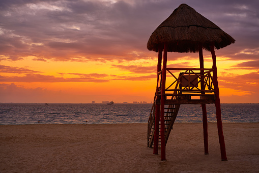 Isla Mujeres island Caribbean beach sunset baywatch tower Riviera Maya Mexico