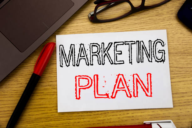 istock Handwriting Announcement text showing Marketing Plan. Business concept for Planning Successful Strategy written on paper, wooden background in office with copy space, marker pen and glasses 913691890