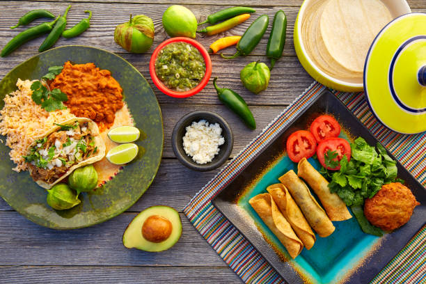 istock Mexican carnitas tacos with flautas from Mexico 913697062