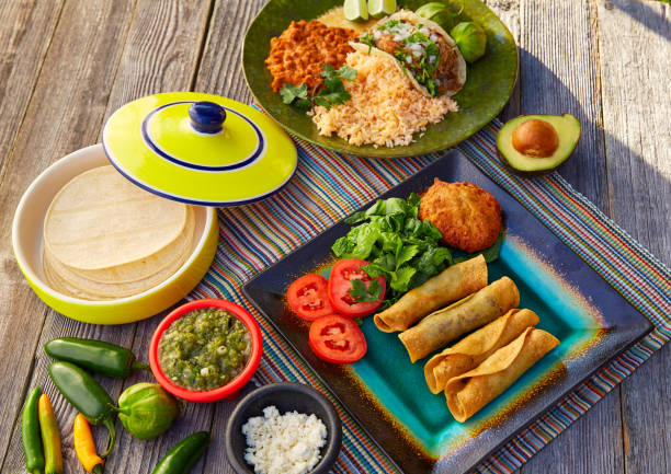 istock Mexican carnitas tacos with flautas from Mexico 913697118