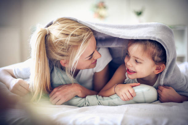 istock Playing with Mommy, little girl. 913697172