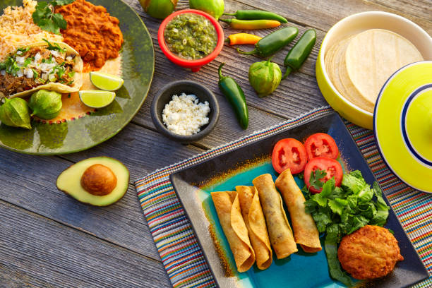 istock Mexican carnitas tacos with flautas from Mexico 913697178