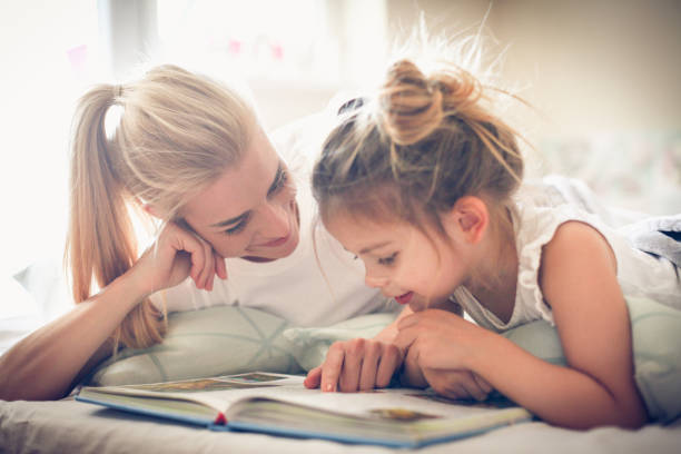 istock Mother learning me reading. Morning play. 913697420