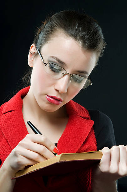 istock beautiful young woman writing 91369997