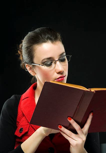 istock beautiful young woman reading book 91369998