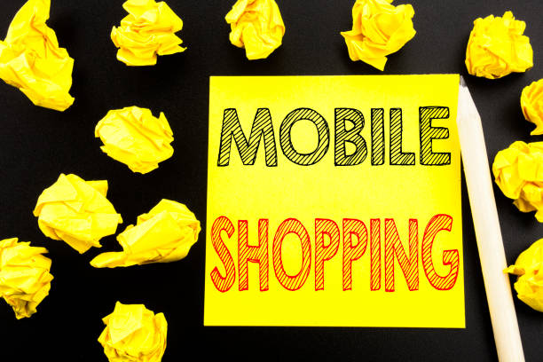 istock Handwritten text showing Mobile Shopping. Business concept writing for Cellphone online order written on sticky note paper on the black background. Folded yellow papers on the background 913700606