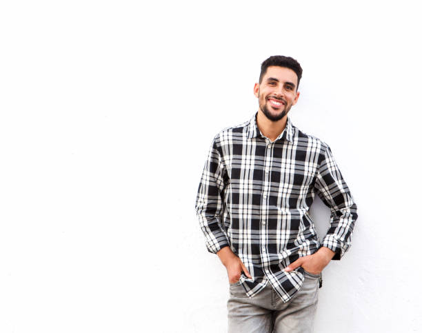 istock happy young north african man smiling against white background 913700958
