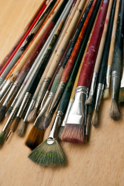 istock Much used art paint brushes 913701486