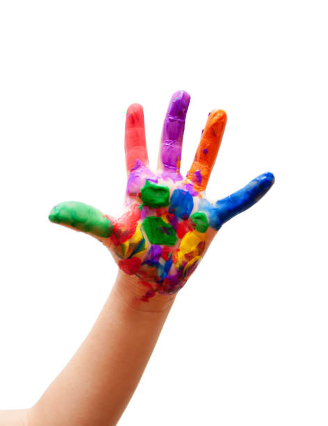 Child with colour paint on his hands isolated on white background
