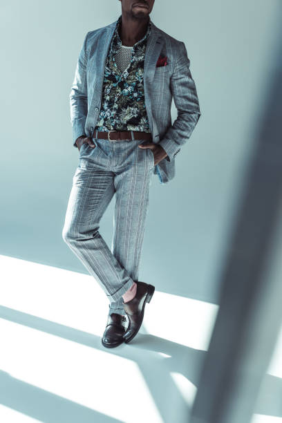 istock Stylish african american man with hands in pockets 913705170