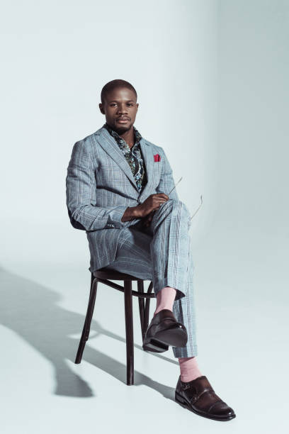 istock african american man in suit on chair 913705744