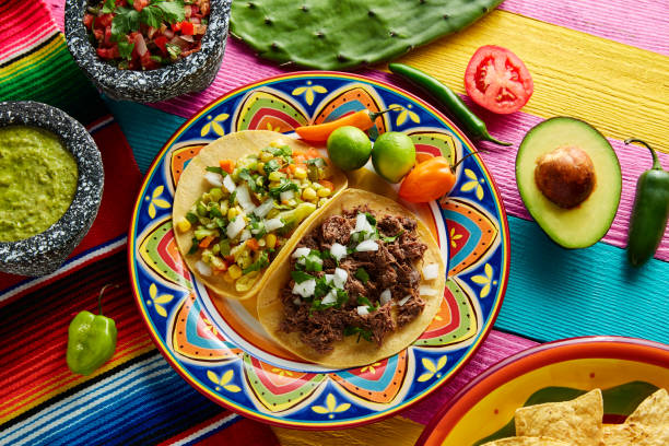 istock Mexican platillo tacos barbacoa and vegetarian 913708640