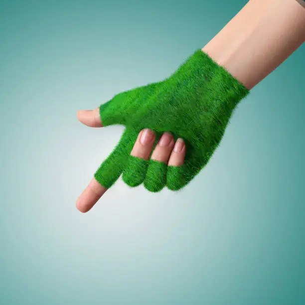 Photo of Go Green Concept
Hand in glove grass indicates the direction.