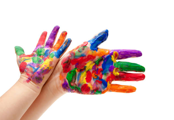 istock Child with colour paint on his hands isolated on white background 913709084