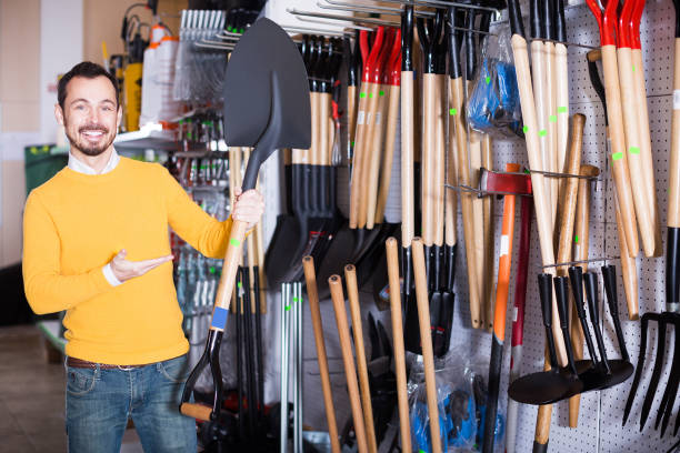 istock Man demonstrating a garden shovel 913709670