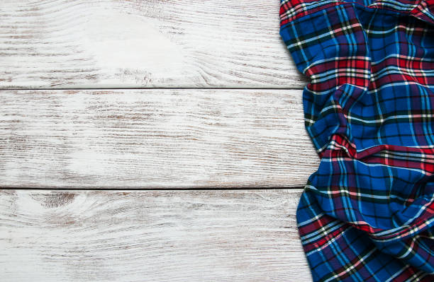 istock Checkered napkin on a wooden background 913710484