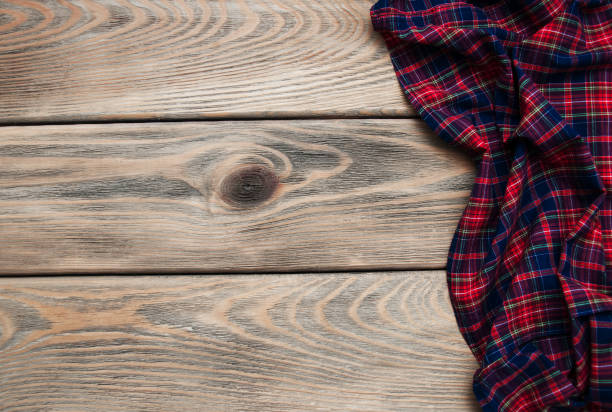 istock Checkered napkin on a wooden background 913710538