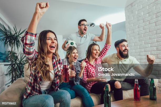 Group Of Friends Watching A Football Match On Tv Stock Photo - Download Image Now - Fan - Enthusiast, Sport, Television Set