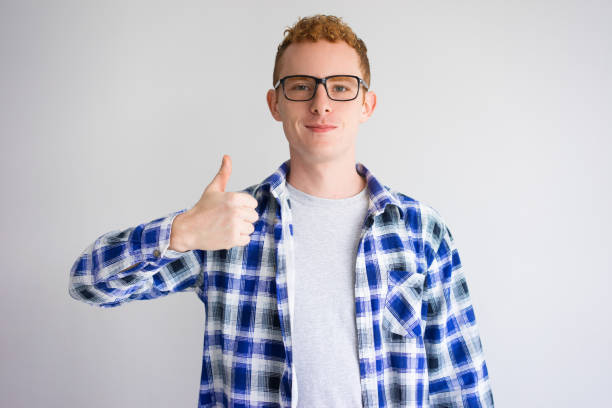 istock Content Red Haired Caucasian Student Showing Thumb Up 913714232