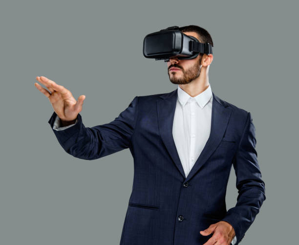 istock Male in a suit with virtual reality glasses on his head. 913714802