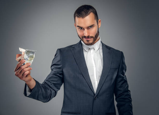 istock A man in a suit isolated on grey background. 913717006