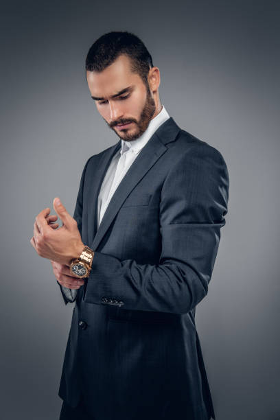 istock A man in a suit isolated on grey background. 913717176