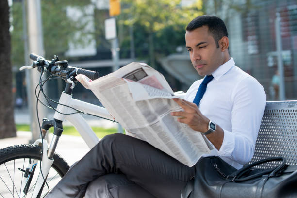 istock Busy broker analyzing news resting in park 913717332