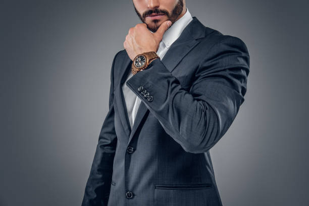 istock A man in a suit isolated on grey background. 913717422