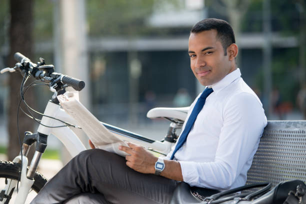 istock Cheerful freelancer relaxing with newspaper 913717458