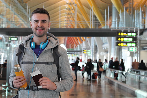 Young traveler ready for an adventure at the airport.