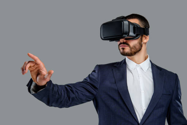 istock A man in a suit with virtual reality glasses on his head. 913721694