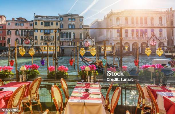 Restaurant Tables Near The Canal Of Venice Italy Stock Photo - Download Image Now - Venice - Italy, Italy, Restaurant