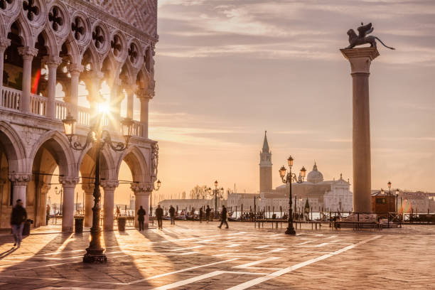 St. Mark's Square, Venice, Italy Venice is a city in northeastern Italy and the capital of the Veneto region. It is situated across a group of 118 small islands that are separated by canals. bell tower tower stock pictures, royalty-free photos & images