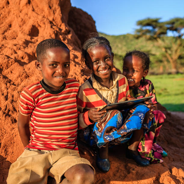 istock Little African children using digital tablet, East Africa 913725234