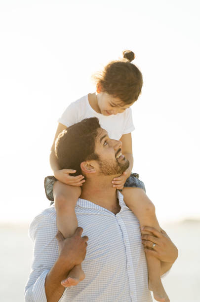 istock Father and daughter spending time together outside in the sun 913729200