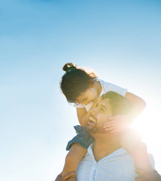 istock Father and daughter spending time together outside in the sun 913732434