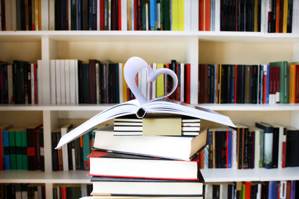 Books stack in front of a bookshef.Love reading concept.