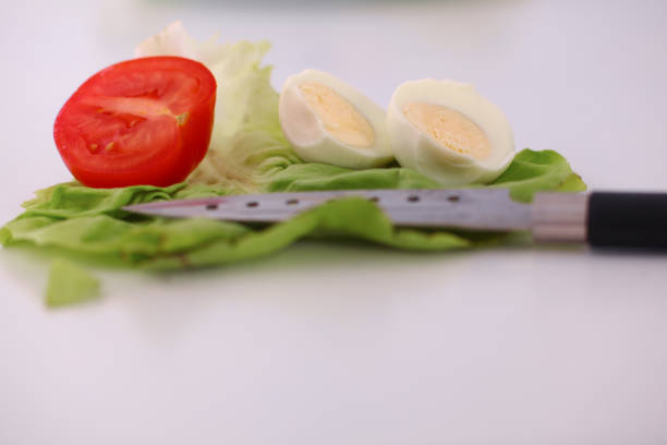salad from fresh vegetables in a plate on a table, selective focus.
