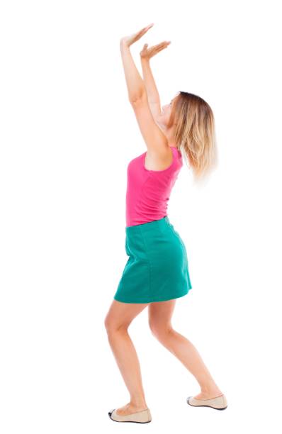istock back view of woman protects hands from what is falling 913734000