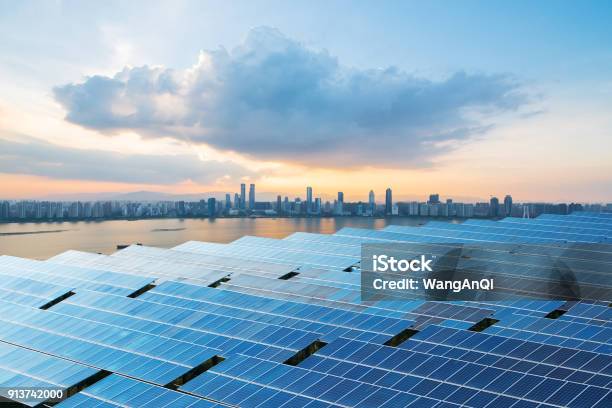 Solar Panels With Cityscape Of Singapore Stock Photo - Download Image Now - Singapore, Solar Panel, Solar Energy