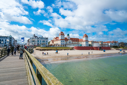 historic beautiful pier at the baltic sea in Ahlbeck Heringsdorf with empty beach in Usedom