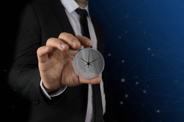 istock business man hand clock in virtual screens 913745948