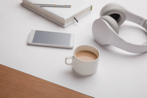 istock Headphone, coffee cup, smartphone with note and pen 913749272