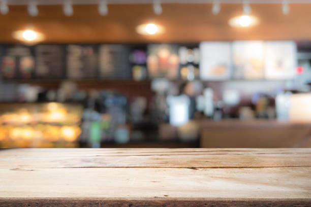 istock Wood table top on coffee cafe counter bar background 913749928